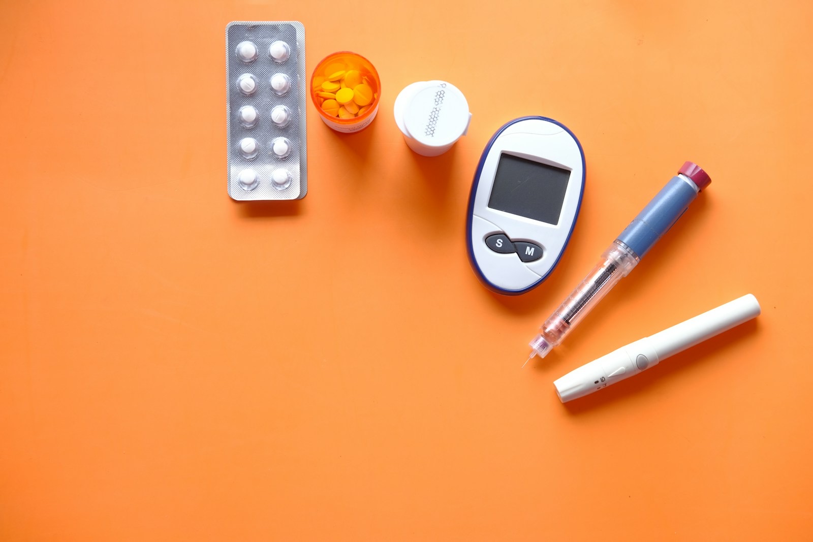 Continuous glucose monitor and healthy whole-food meal — representing comprehensive blood sugar testing