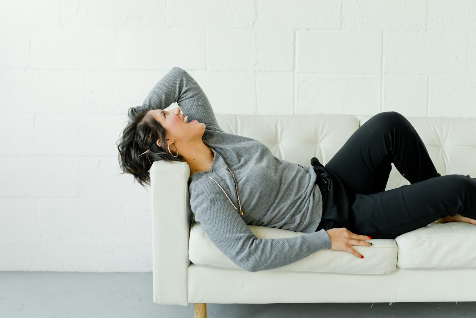 Calm woman resting comfortably at home in soft daylight