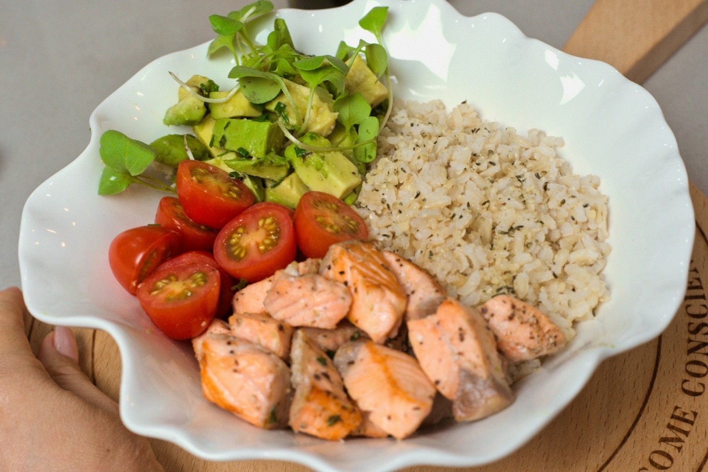 White bowl with chicken, rice, tomatoes and avocado — heart-healthy meal